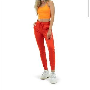 THE WOMEN'S SELECT JOGGER - BLOOD ORANGE